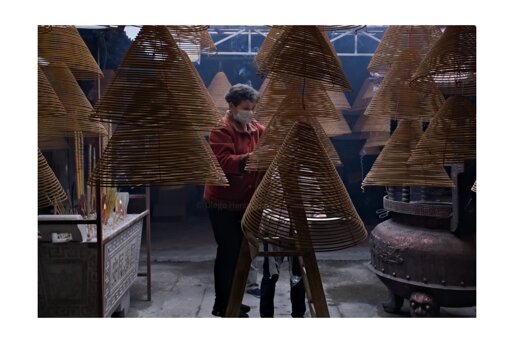 The woman in the photo was getting a temple ready for the Chinese New Year celebrations. 
I know, it took me a while to post… I was out shooting for like eight hours straight, basically turned into a temple decoration myself and went off the grid. But hey, @lostintraval gave me the push I needed—so here it is. Thanks a lot!