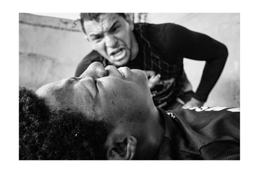 This photo is part of a project I worked on called Favela Kombat: Girls Fight Back, and it was truly something special to be part of. I spent time visiting different favelas across Rio de Janeiro, where I met women who had all faced some form of violence, loss, or struggle. What connected them was a powerful choice they made: they decided to fight back through Mixed Martial Arts.

Each of them had a dream. Some hoped to one day step into the UFC ring. Others simply wanted to feel strong again. In a place where opportunities are often scarce, they found strength in the rhythm of training, in the sweat of each round, and in the sisterhood they built along the way.

As a photographer, I was there to document it all. But more than taking photos, I left with stories, lessons, and a deep admiration for their resilience. These women showed me that fighting back isn't just about fists. It's about reclaiming who you are, one punch at a time.